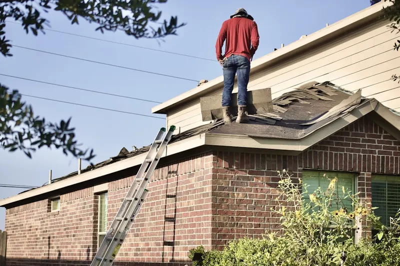 Professional roofer working on a residential roof in Chambersburg